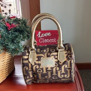 Justice Brown And Gold Bag